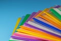 A row of multi-colored plastic folders for paper on a blue background Royalty Free Stock Photo