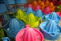 Multi colored plastic squeezers at market counter Royalty Free Stock Photo