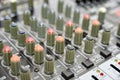 Multi-colored potentiometers on a mixing console, close-up Royalty Free Stock Photo