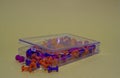 Multi-colored pushpins in a clear box Royalty Free Stock Photo