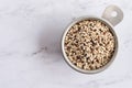 Rainbow Quinoa in a Measuring Cup