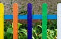 Multi colored rainbow wooden fence in garden Royalty Free Stock Photo