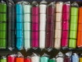 Multi-colored ribbon on the shelf. Textile shop. Sewing goods store Royalty Free Stock Photo