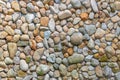 Rounded pebbles embedded in a concrete wall Royalty Free Stock Photo