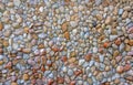 Rounded pebbles embedded in a concrete wall Royalty Free Stock Photo