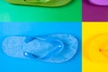 multi-colored rubber flip flops on multicolored backgrounds, view from above