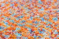Multi-colored rug, macro photography. Abstract texture of long-piled carpet