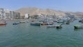 Multi colored rustic fishing boats in Ancon, Lima north