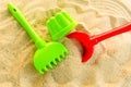 A multi-colored set of children`s toys for the summer games in the sandbox or on the sandy beach. The concept of  holidays Royalty Free Stock Photo