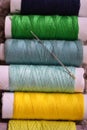 multi-colored sewing threads and a needle Royalty Free Stock Photo