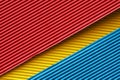 Multi-colored sheets of craft corrugated colored paper or cardboard. Red, yellow and blue. The concept of creativity and paper Royalty Free Stock Photo