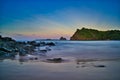 Long exposure view from rocks, sunset, mountains and multi colored sky