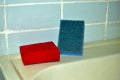 Multi-colored sponges for cleaning in the bathroom on the sink Royalty Free Stock Photo