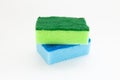 Multi-colored sponges for cleaning and washing dishes on white background Royalty Free Stock Photo