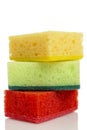 Multi -colored sponges for washing dishes on each other. Devices for cleaning the house, cleanliness and health. Isolated on a Royalty Free Stock Photo