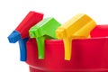 Multi colored spray nozels in a red bucket Royalty Free Stock Photo