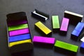 Multi-colored stapler staples on a black background Royalty Free Stock Photo