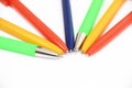 Multi-colored stationery pens for writing on a white background Royalty Free Stock Photo