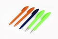 Multi-colored stationery plastic writing pens on a white background Royalty Free Stock Photo