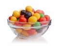 Multi-colored sweets in a glass bowl isolated on white Royalty Free Stock Photo