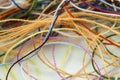 Multi-colored tangled colorful needlecraft silk thread rope. Mac Royalty Free Stock Photo