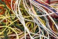 Multi-colored tangled colorful needlecraft silk thread rope. Mac Royalty Free Stock Photo