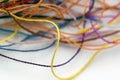 Multi-colored tangled colorful needlecraft silk thread rope. Mac Royalty Free Stock Photo