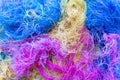 Multi-colored tangled threads abstract texture pattern background. Macro shot of colorful needlecraft silk thread ropes Royalty Free Stock Photo