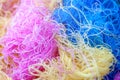 Multi-colored tangled threads abstract texture pattern background. Macro shot of colorful needlecraft silk thread ropes Royalty Free Stock Photo