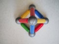 Multi-colored tetrahedron built of children`s magnetic designer