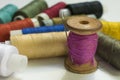 Multi-colored threads on bobbins and a needle