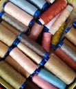 Multi-colored threads lie in a box Royalty Free Stock Photo