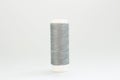 Grey threads for sewing on a white background Royalty Free Stock Photo