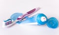 Multi-colored toothpaste on a toothbrush and tube Royalty Free Stock Photo