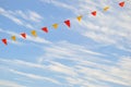 Multi Colored Triangular Flags Hanging in the Sky Royalty Free Stock Photo