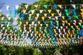 Multi colored triangular Flags Hanging in the sky on outdoor road at celebration party Royalty Free Stock Photo