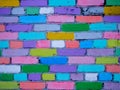 Multi-colored wall of bricks painted by children Royalty Free Stock Photo