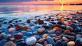 Multi-colored wet pebbles on the seashore against beautiful sunset