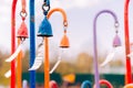 Multi-colored wind chimes with metal plates that create a beautiful sound from the wind. selective focus