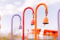 Multi-colored wind chimes with metal plates that create a beautiful sound from the wind. selective focus