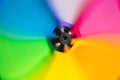 Multi-colored wind toy on a black background Royalty Free Stock Photo