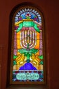 Multi-colored window stained glass inside the Jewish synagogue. Inscriptions in Polish and Hebrew Royalty Free Stock Photo