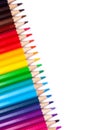 Multi-colored wooden pencils in rainbow shades on a white isolated background mock up, vertical, high quality photo