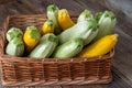 Multi-colored zucchini yellow, green, white, orange on the wooden table close-up. Food background. Fresh harvested Royalty Free Stock Photo