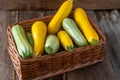 Multi-colored zucchini yellow, green, white, orange on the wooden table close-up. Food background. Fresh harvested Royalty Free Stock Photo