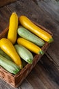 Multi-colored zucchini yellow, green, white, orange on the wooden table close-up. Food background. Fresh harvested Royalty Free Stock Photo