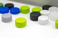 The multi-colors plastic bottle caps on the white background Royalty Free Stock Photo