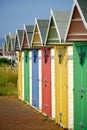 Multi-coloured beach huts in Eastbourne beneath a clear blue sky in the summer Royalty Free Stock Photo