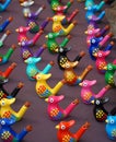 Multi Coloured Bird Whistles on table.