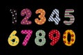 Multi-coloured numbers on a black background. Primary education concept Royalty Free Stock Photo